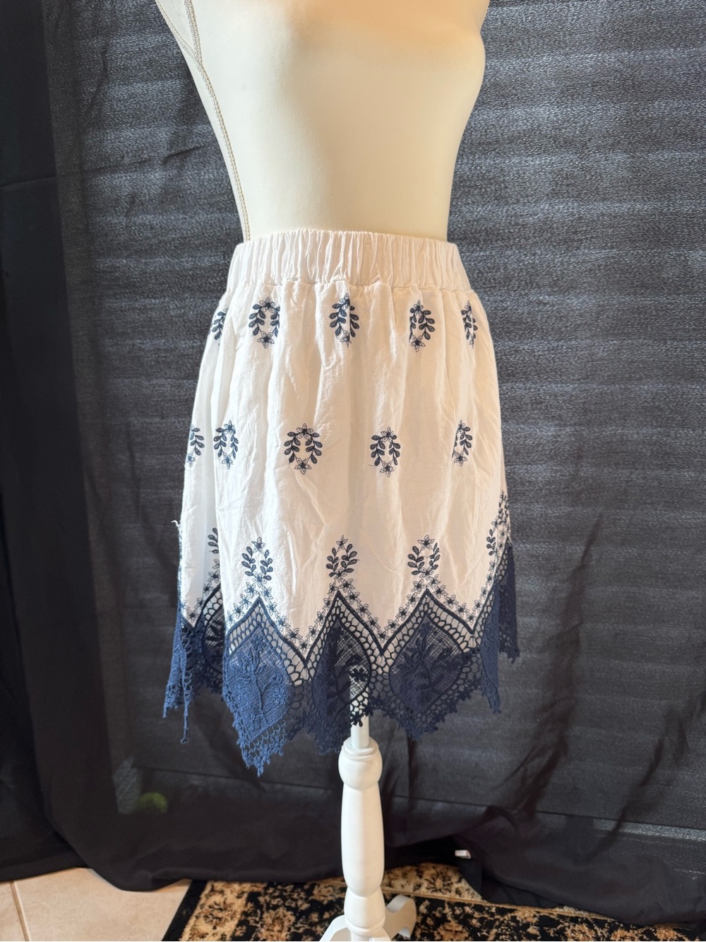 Emma & Elsa White Midi Skirt with Navy Embroidered Motif and A Navy Lace Hem